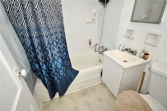 full bathroom featuring shower / tub combo, vanity, and toilet