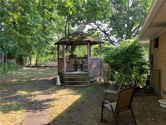 view of yard with a wooden deck and a gazebo