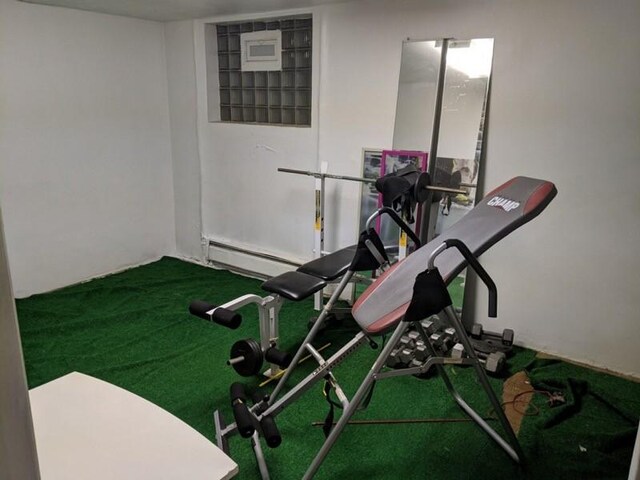 workout area with a baseboard radiator