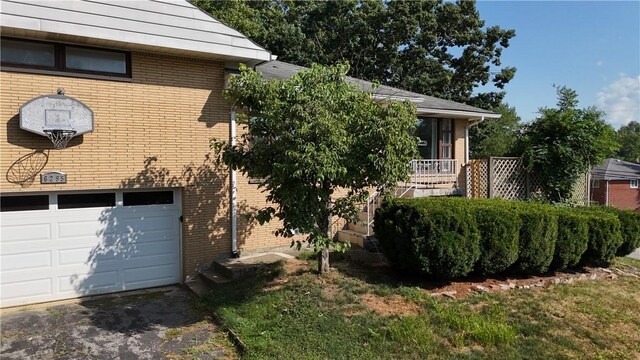 view of property exterior featuring a garage