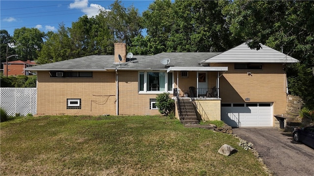 view of front facade with a garage and a front lawn