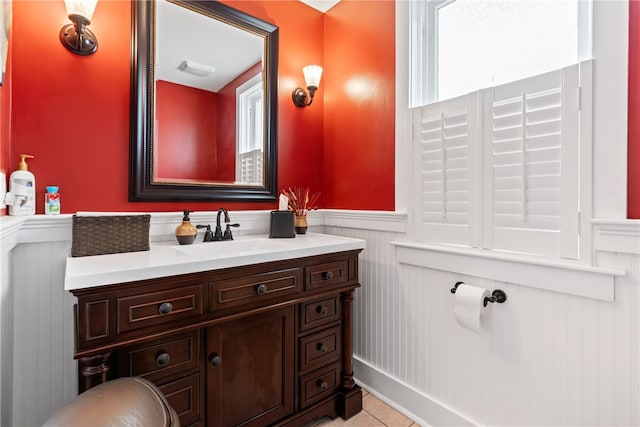 bathroom with tile patterned floors and vanity