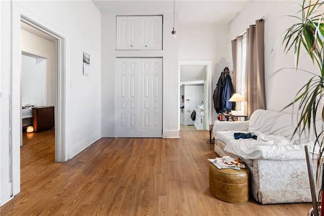 hall with hardwood / wood-style floors