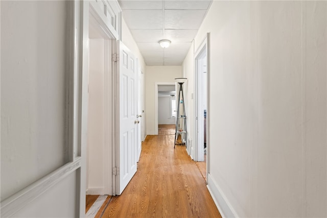 corridor featuring light hardwood / wood-style floors