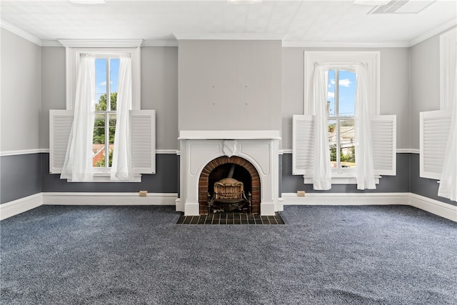 unfurnished living room featuring dark colored carpet, a fireplace, and crown molding