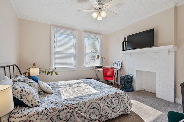 bedroom featuring crown molding, carpet flooring, a textured ceiling, and ceiling fan