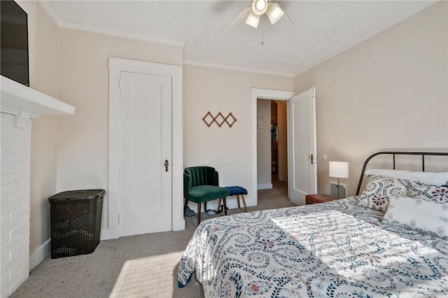 carpeted bedroom featuring crown molding, a textured ceiling, and ceiling fan