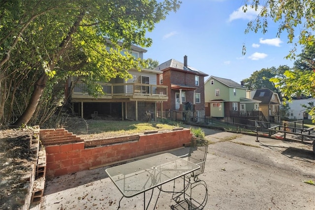 rear view of house featuring a patio