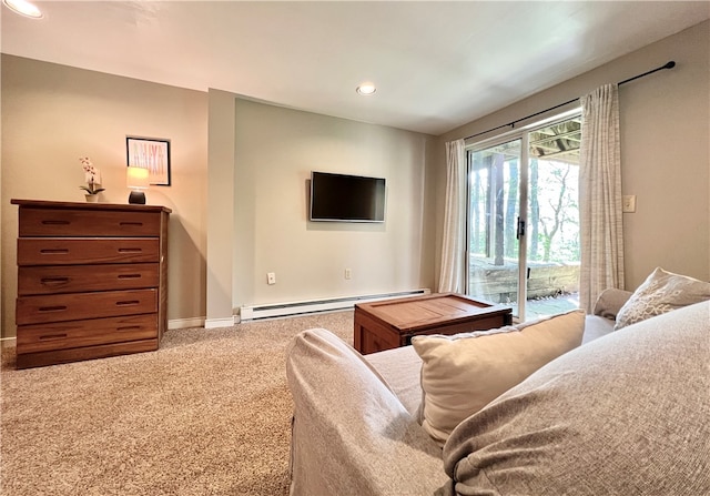 carpeted living room featuring a baseboard heating unit