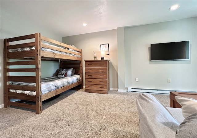 bedroom featuring carpet and a baseboard heating unit