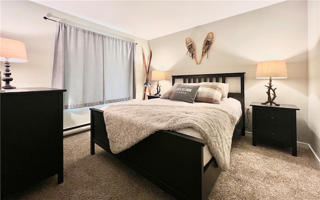 carpeted bedroom with baseboard heating