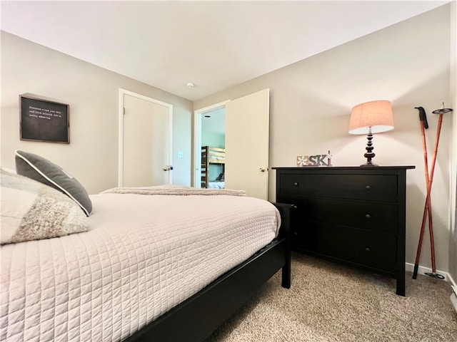 bedroom featuring light colored carpet