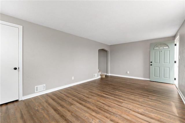 unfurnished room featuring wood-type flooring