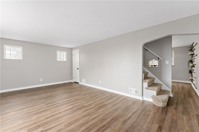 unfurnished living room with hardwood / wood-style flooring