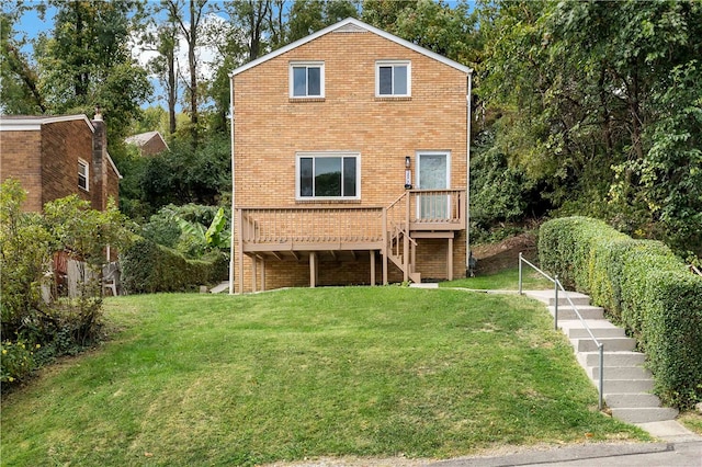 back of house featuring a yard and a wooden deck