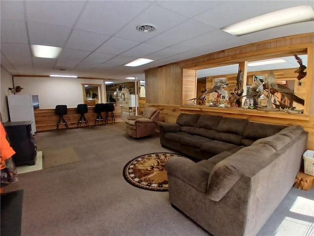540 Market St, Fairfield Twp, PA 15923 - carpeted living room featuring wooden walls, a drop ceiling, and visible vents