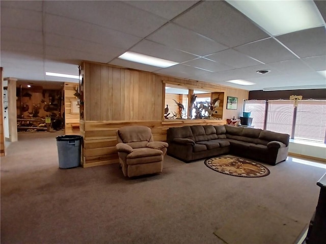 540 Market St, Fairfield Twp, PA 15923 - carpeted living room featuring visible vents, wood walls, and a drop ceiling