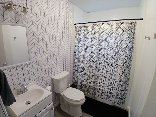 bathroom featuring vanity, toilet, and a shower with curtain