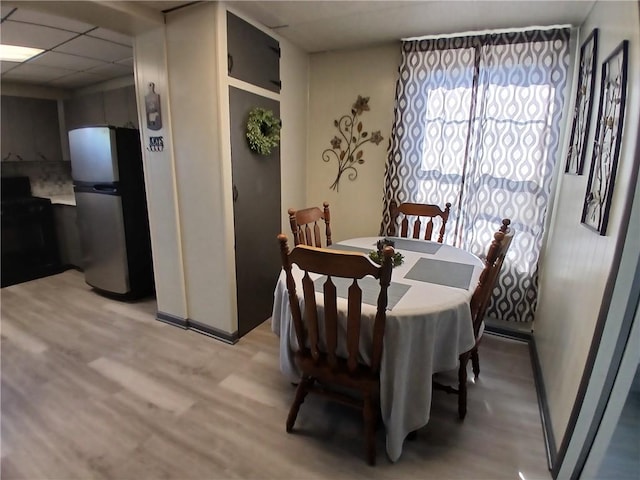540 Market St, Fairfield Twp, PA 15923 - dining area with a paneled ceiling, baseboards, and light wood-style floors