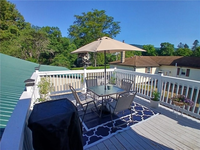 540 Market St, Fairfield Twp, PA 15923 - wooden deck featuring grilling area and outdoor dining space