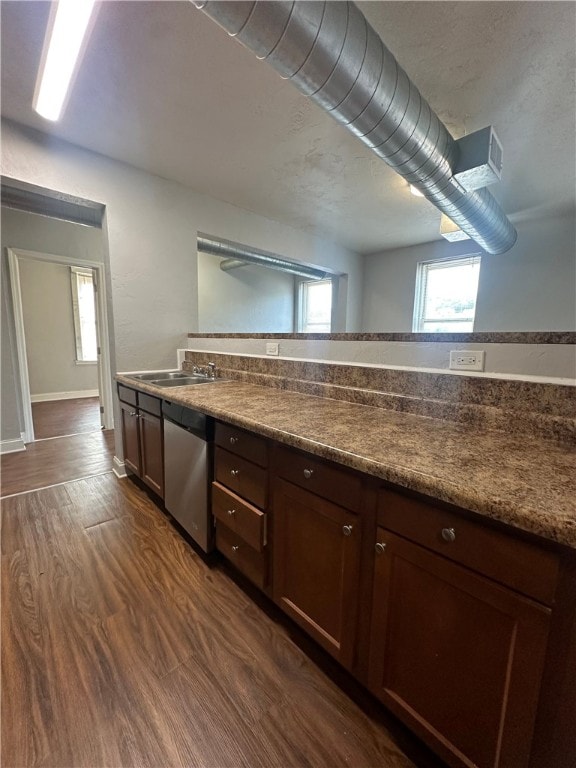 kitchen with sink, dishwasher, dark hardwood / wood-style floors, and dark brown cabinetry