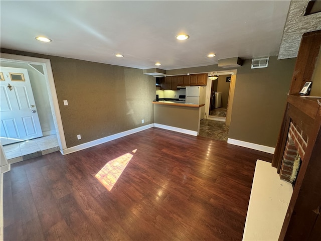 unfurnished living room featuring dark hardwood / wood-style flooring