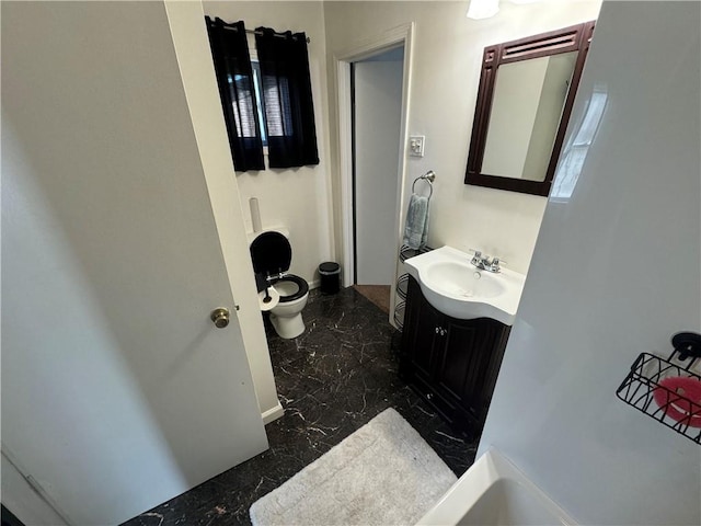 bathroom with vanity and toilet