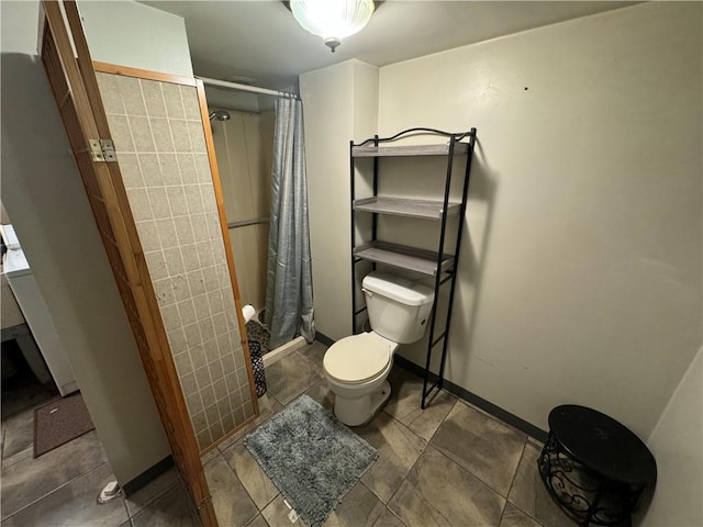 bathroom featuring curtained shower, tile walls, and toilet