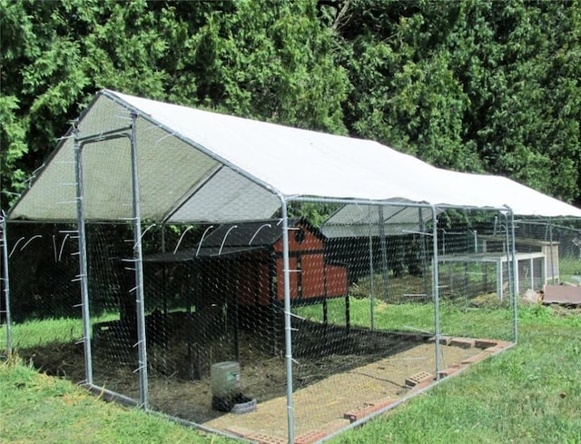 view of property's community with an outbuilding