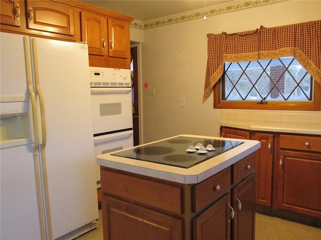 kitchen with white appliances and a kitchen island