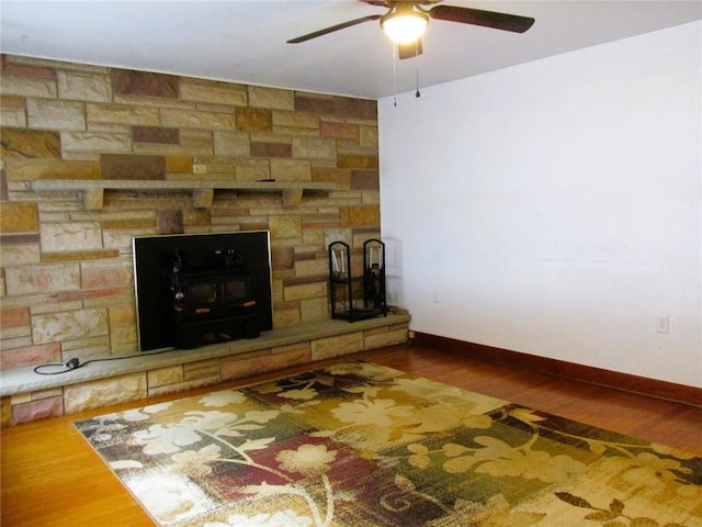 unfurnished living room with ceiling fan and hardwood / wood-style floors