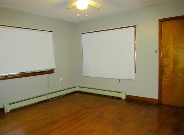 unfurnished room with ceiling fan, dark hardwood / wood-style flooring, and baseboard heating