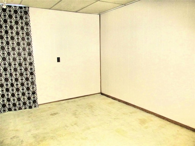 spare room featuring a paneled ceiling