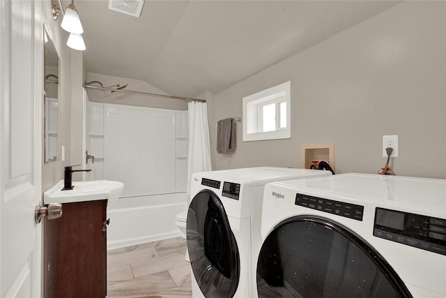 laundry room with sink and independent washer and dryer