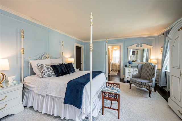 bedroom with crown molding and light wood-type flooring