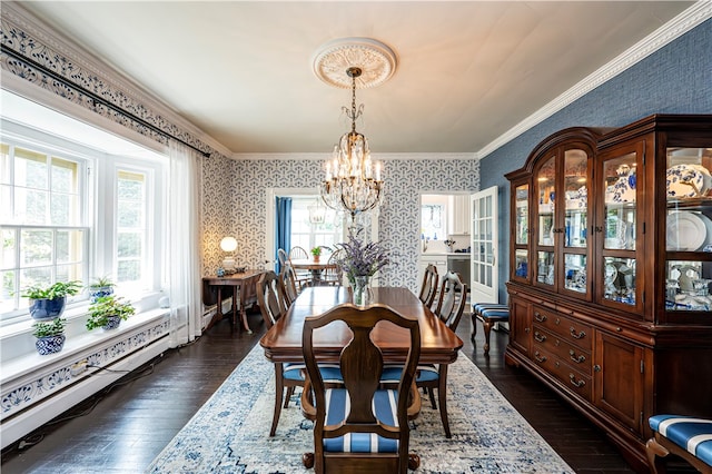 dining space featuring dark wood-type flooring, ornamental molding, baseboard heating, and a notable chandelier