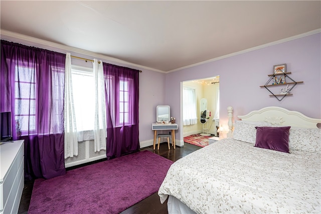 bedroom with hardwood / wood-style flooring and ornamental molding