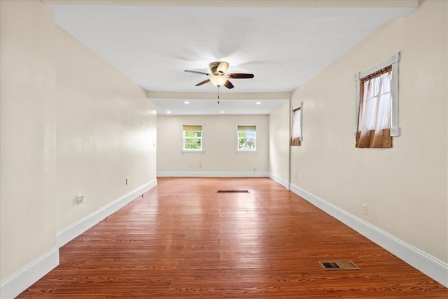 unfurnished room with ceiling fan and hardwood / wood-style floors