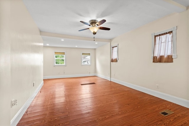 spare room featuring ceiling fan and light hardwood / wood-style floors