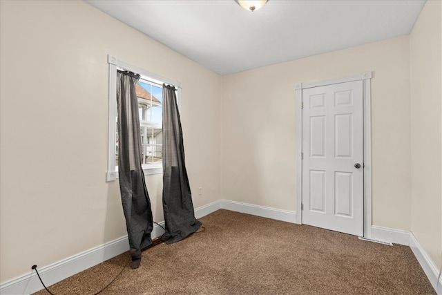 empty room featuring carpet floors