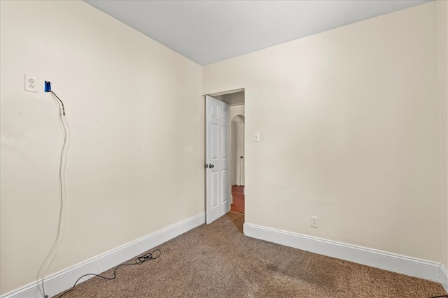 spare room featuring carpet flooring