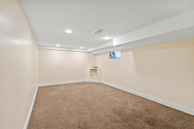 basement featuring carpet flooring