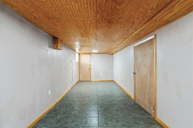 unfurnished room with wood ceiling