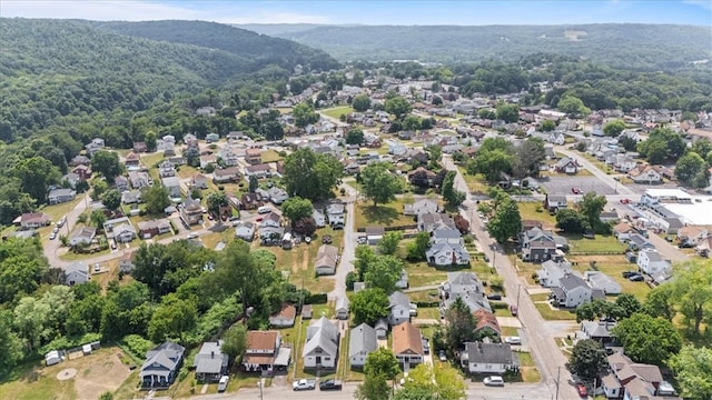 birds eye view of property with a mountain view