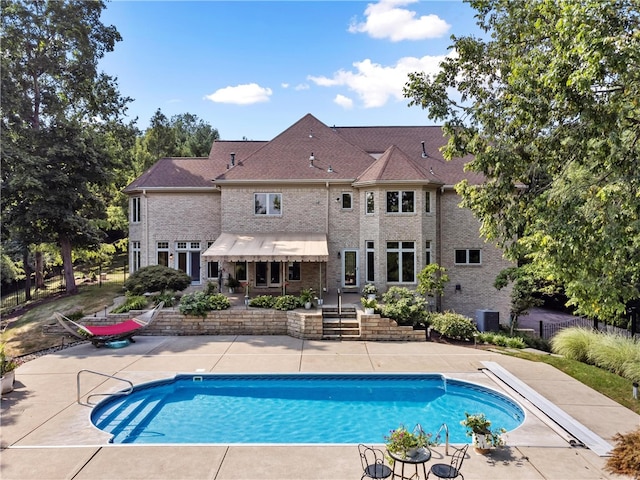 view of swimming pool featuring central AC and a patio area