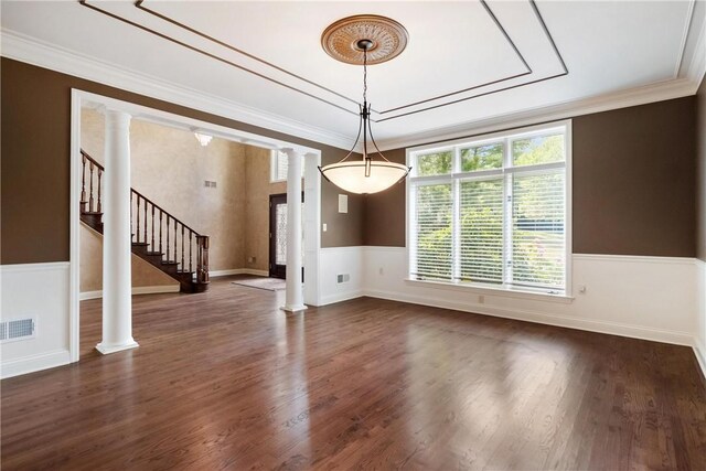 interior space with ornamental molding, ornate columns, and dark wood-type flooring