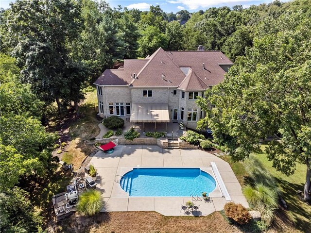 view of pool featuring a patio