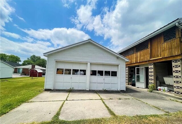 garage with a lawn