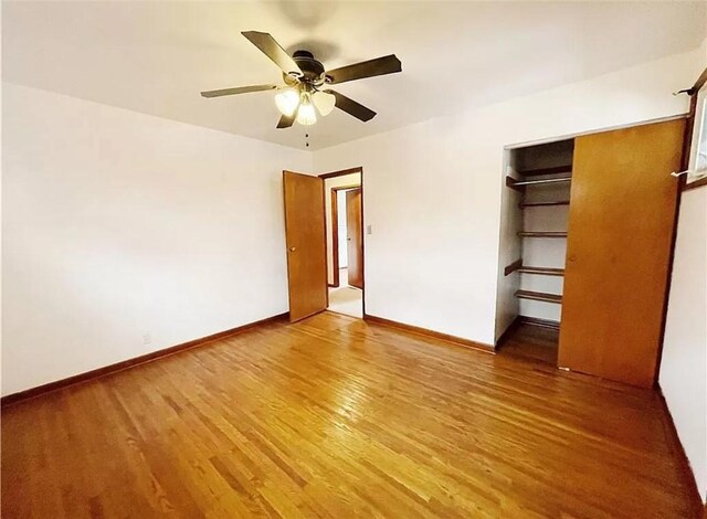 unfurnished bedroom with a closet, ceiling fan, and light wood-type flooring