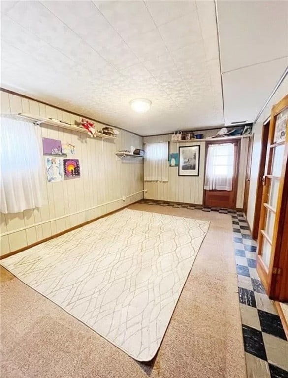 basement with light colored carpet